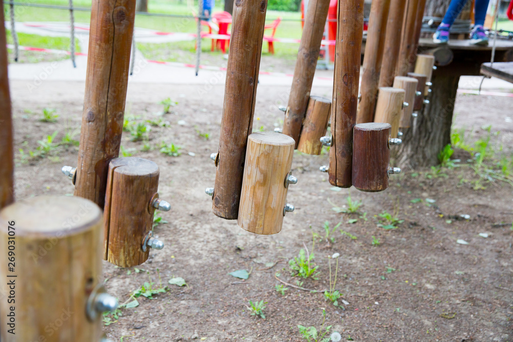 Children's Adventure Park bridges, ropes and stairs. Adventure climbing on high wired park. Course of high ropes in forest. Children's Adventure Park bridges, ropes and stairs. Adventure climbing on high wired park. Course of high ropes in forest.