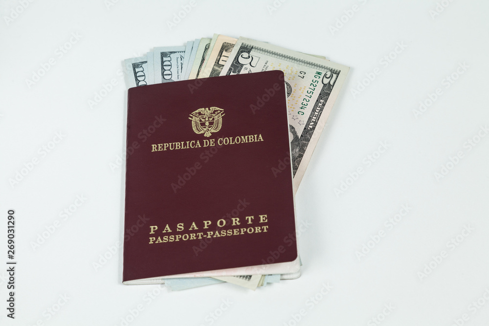 travel concept, Colombian passport with dollar bills for travel abroad travel concept, Colombian passport with dollar bills for travel abroad