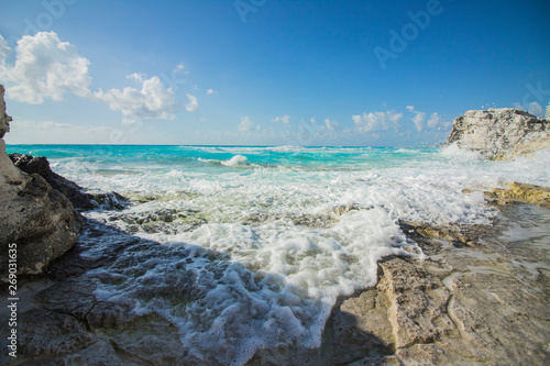 Cancun beach. The caribbean sea beats against the rocks © David Merino