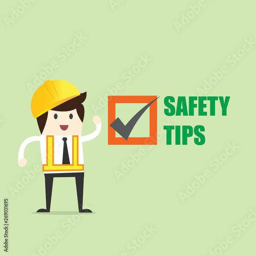 Worker with Safety tips symbol security sign on green