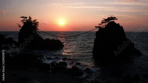Sunset over Scenic Rocks and a Sea: Hatagoiwa Rocks in Noto Peninsula, Ishikawa Pref., Japan  photo
