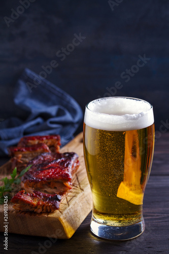 Beer and pork spare ribs. Ale and meat. Beer and food concept - Image