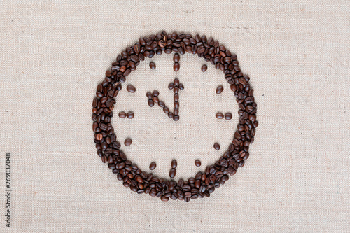 Clock made of coffee beans shot close up