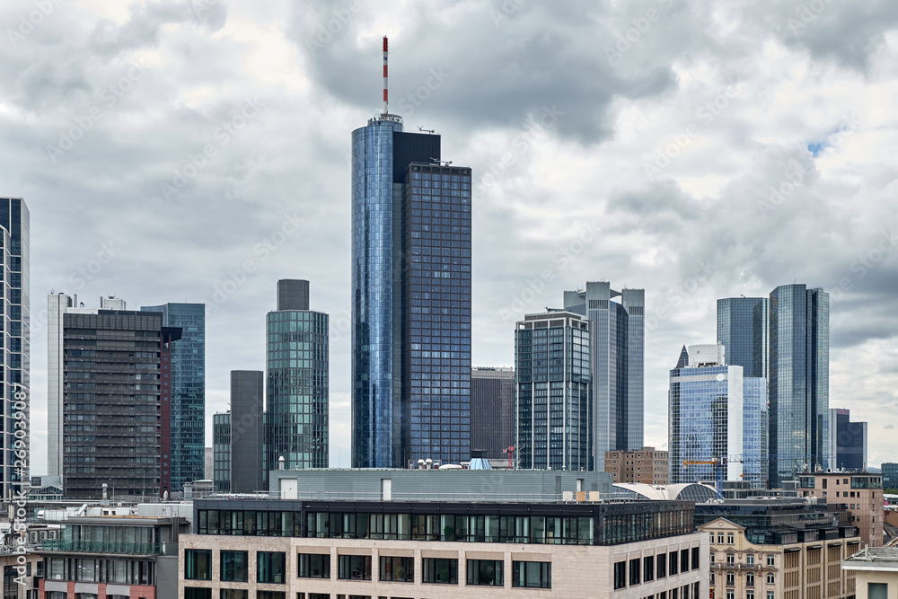 Frankfurt am Main gloomy cityscape skyline with bank skyscrapers and cloudy sky