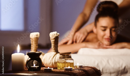 Aroma Spa. Woman Enjoying Back Massage In Luxury Spa photo
