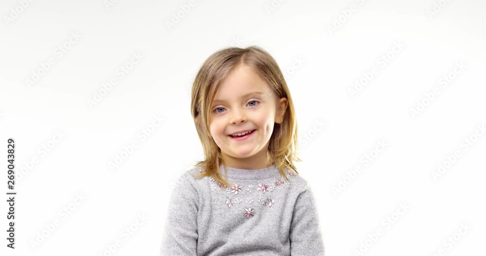 Beautiful happy fun young child blond smarty girl smiling and making faces.Person action.People video portrait isolated on white background.Medium shot.4k video Beautiful happy fun young child blond smarty girl smiling and making faces.Person action.People video portrait isolated on white background.Medium shot.4k video