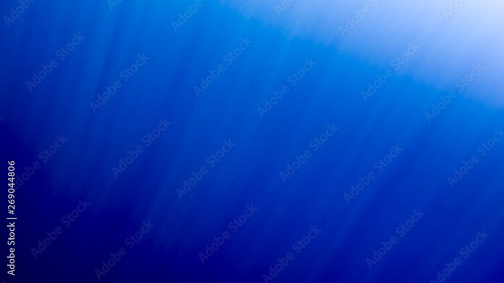 Amazing under water image of swimming fishes and shining sun rays throught the water surface Amazing under water image of swimming fishes and shining sun rays throught the water surface