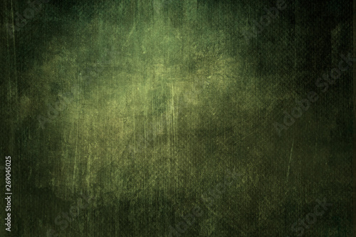 Dark green grungy canvas background or texture