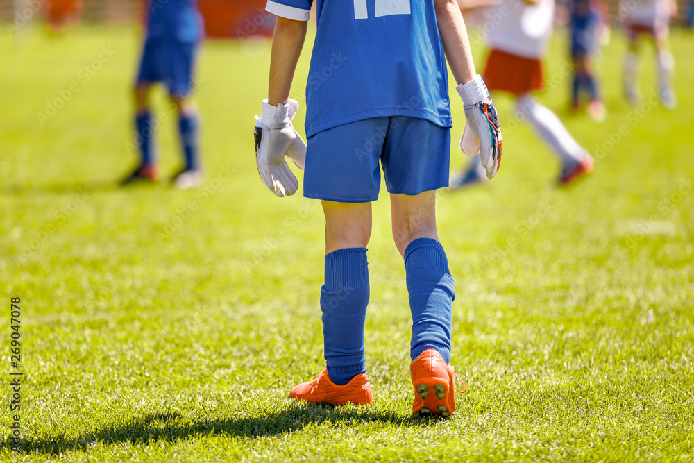 Fototapeta premium Soccer Goalkeeper in Youth Team. Youth Football Teams Compeeting in School Soccer Tournament