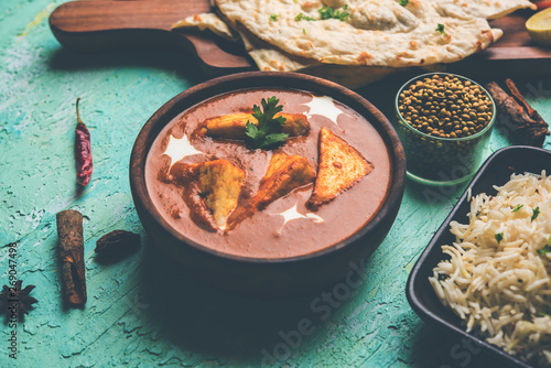 Paneer Butter Masala is a popular North Indian recipe for lunch/dinner made using cottage cheese in red tomato curry. usually served with Rice and chapati/naan. selective focus