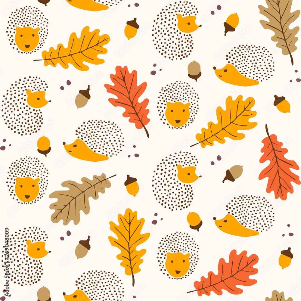 Funny hedgehogs among autumn leaves