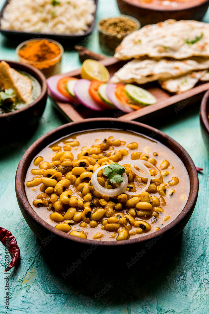 Black Eyed Kidney Beans Curry served in a bowl with Naan and rice Black Eyed Kidney Beans Curry served in a bowl with Naan and rice