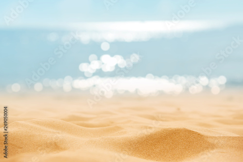 Summer tropical sand beach and bokeh sun light on sea background, copy space.