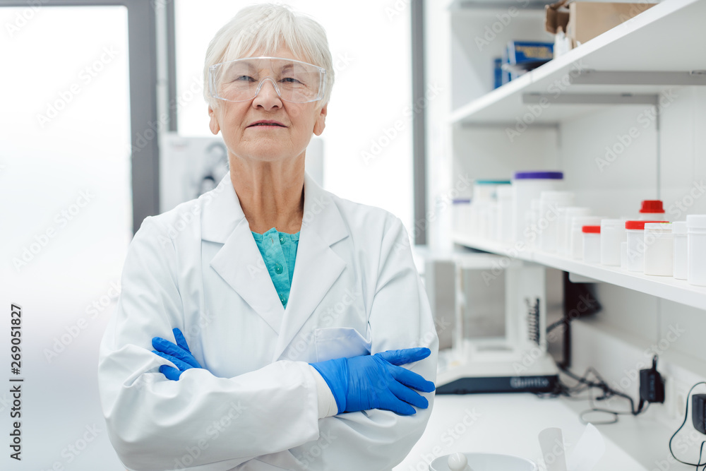 Experienced chemist standing in laboratory of pharmacy