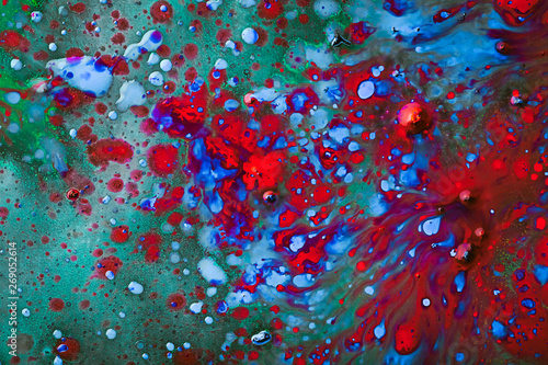 Colorful and creative abstract background of dye on glass