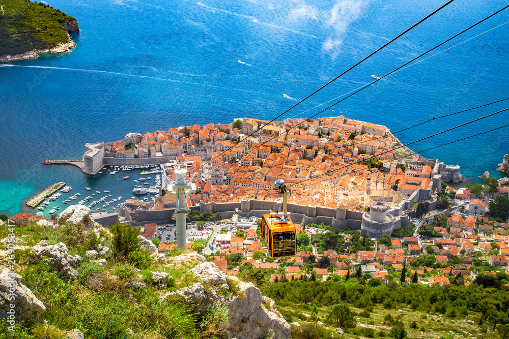 Old town of Dubrovnik with cable car ascending Srt mountain, Dalmatia, Croatia