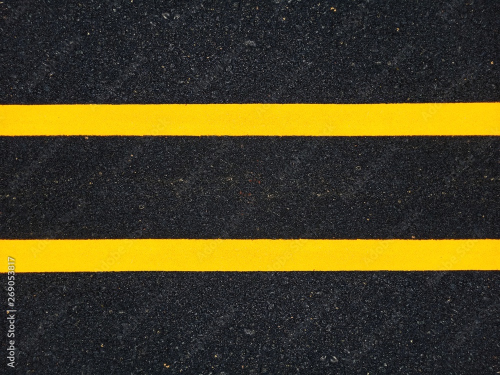 Fototapeta premium Road traffic paint Yellow on the asphalt surface