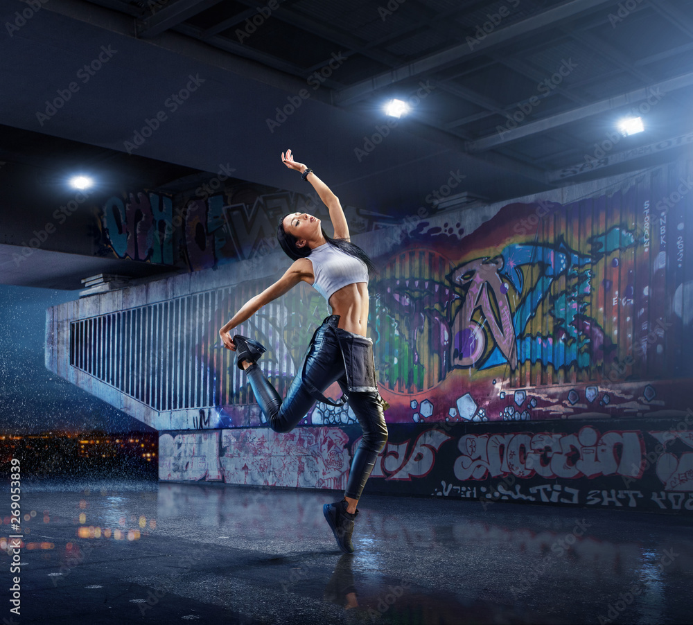 Female Hip Hop Dancer. Beautiful girl dancing at night on the ...