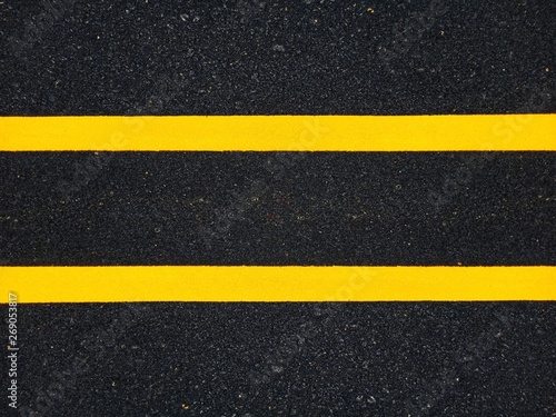 Road traffic paint Yellow on the asphalt surface © suwichan