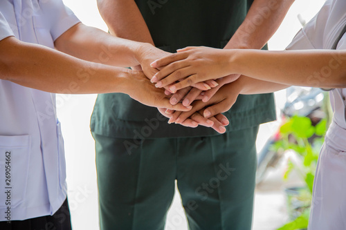 Фотография Doctors and nurses coordinate hands