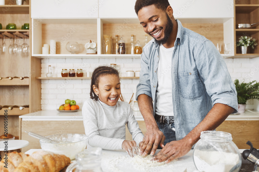 Father and child daughter making pastry