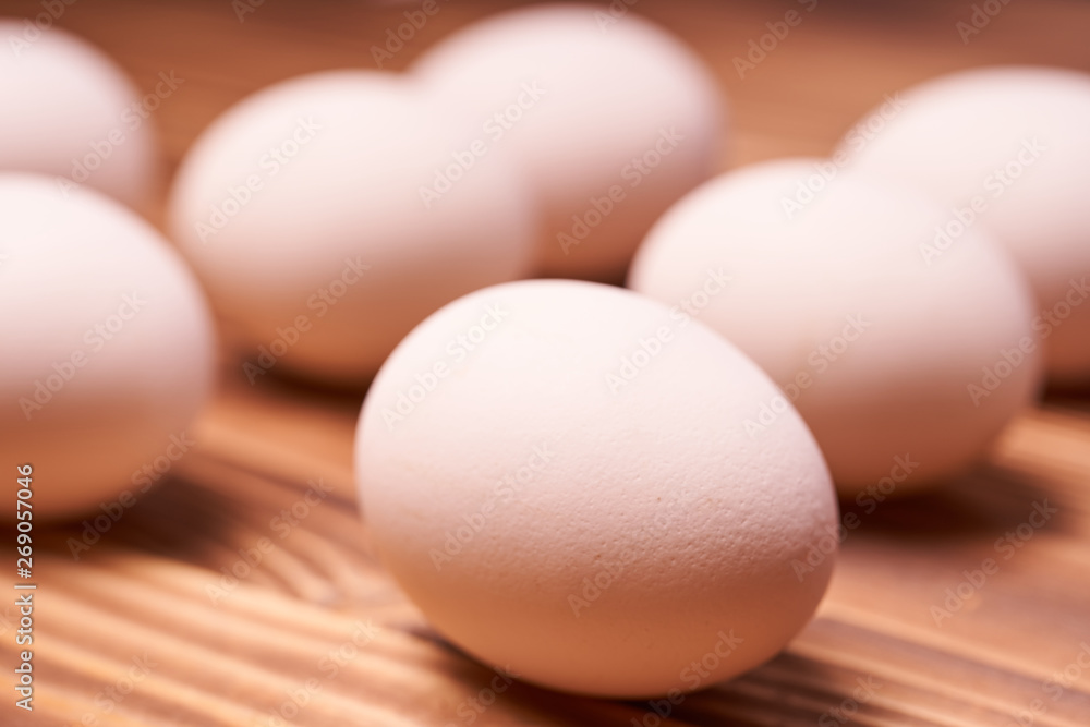 Chicken eggs laid on a wooden table Chicken eggs laid on a wooden table