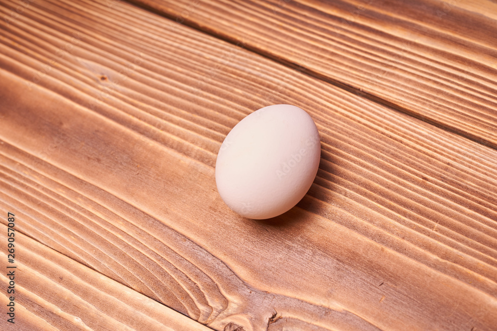 Chicken eggs laid on a wooden table Chicken eggs laid on a wooden table
