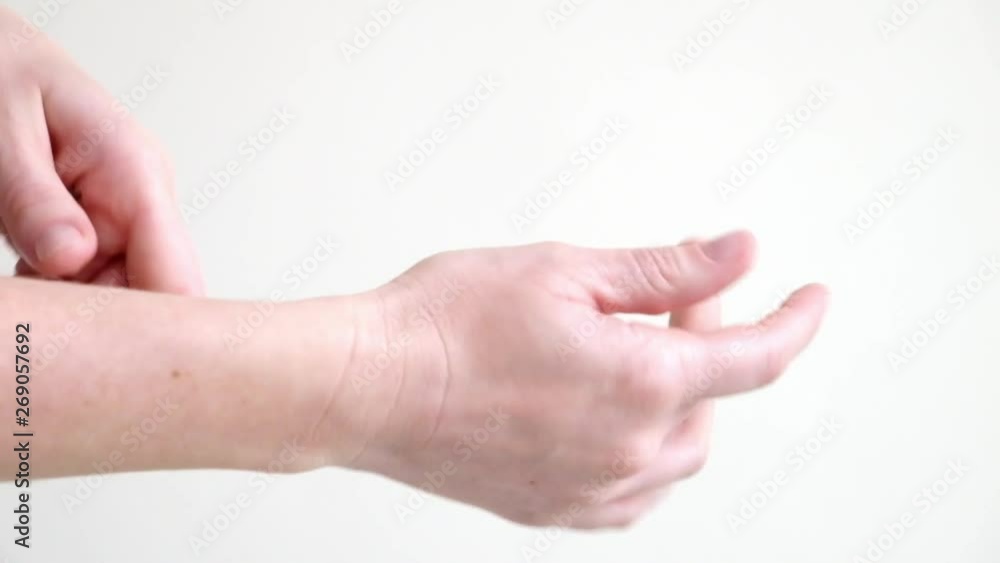 Hands of a young woman applying hand cream, hands massage Hands of a young woman applying hand cream, hands massage