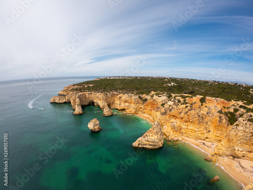 Praia De Marinha Most beautiful beach in Lagoa, Algarve Portugal. Aerial view on cliffs and coast of Atlantic ocean 