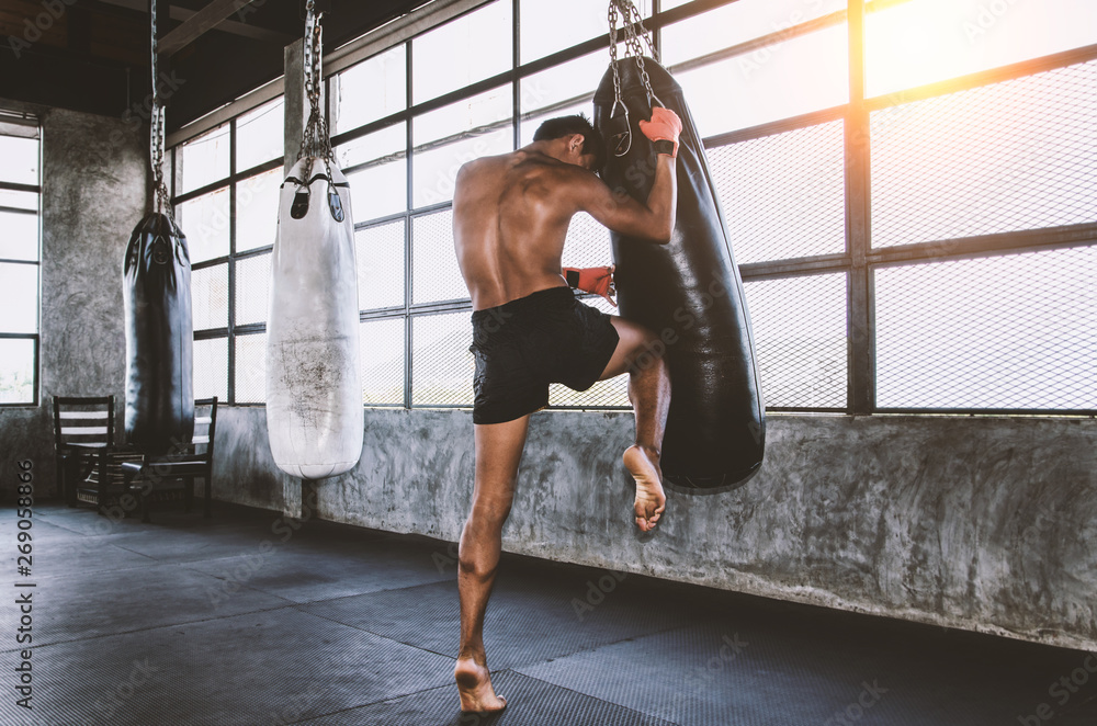 Muay Thai Fighter Training In Gym With