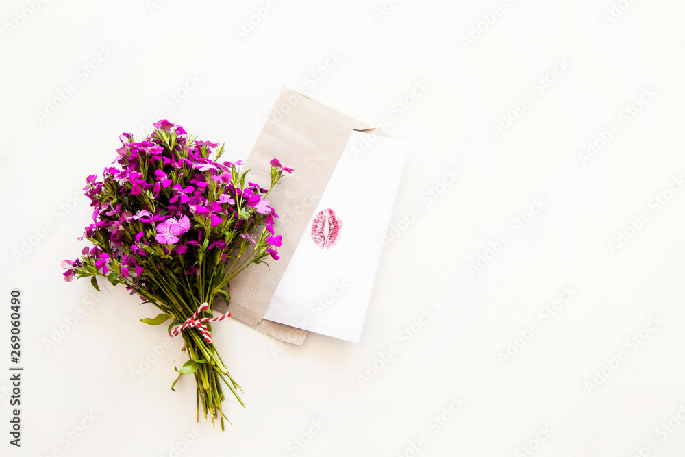 Purple flowers with paper on white background Purple flowers with paper on white background