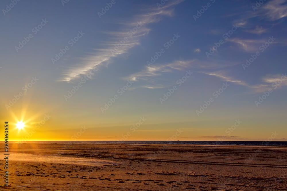 Sunset at the beach on the East Frisian Island Juist in the North Sea, Germany.