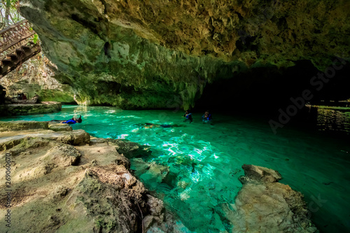 Some people is swimming and snorkeling on Gran Cenote Yucatan