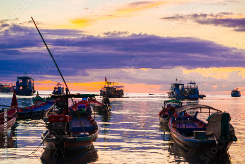 Silhouette seascape sunset wooden boat on sea shore