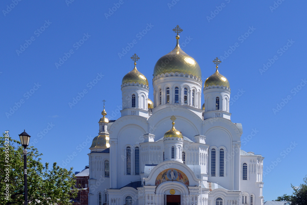white stone Church Cathedral against the blue sky in summer in Sunny weather white stone Church Cathedral against the blue sky in summer in Sunny weather