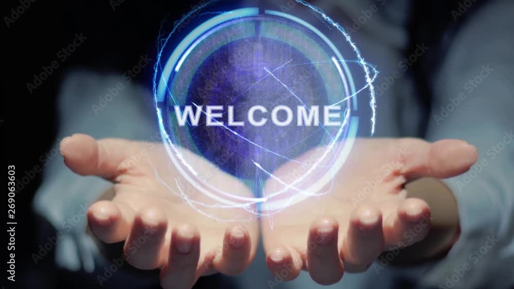 Female hands show a round conceptual hologram with text Welcome. Unrecognizable woman in ashen white on a black background with future holographic technology Female hands show a round conceptual hologram with text Welcome. Unrecognizable woman in ashen white on a black background with future holographic technology