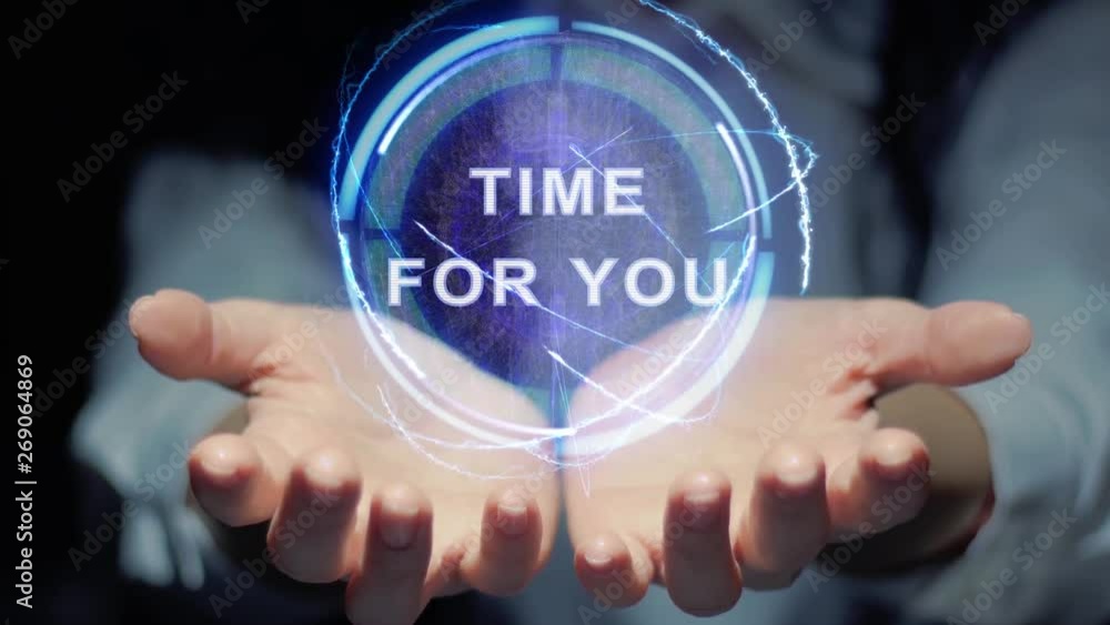Female hands show a round conceptual hologram with text Time for you. Unrecognizable woman in ashen white on a black background with future holographic technology Female hands show a round conceptual hologram with text Time for you. Unrecognizable woman in ashen white on a black background with future holographic technology