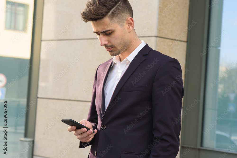 Portrait of successful businessman open in modern city near business center Portrait of successful businessman open in modern city near business center
