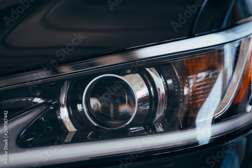 Close up detail on one of the LED headlights modern car.