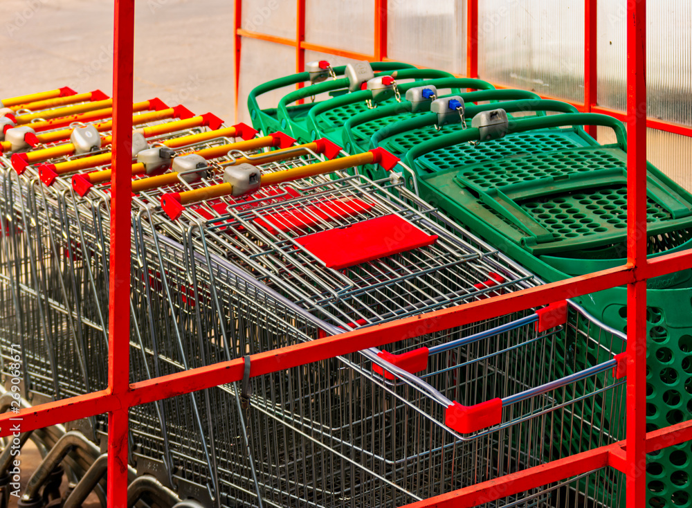 Row of Stacked Supermarket Trolleys Row of Stacked Supermarket Trolleys