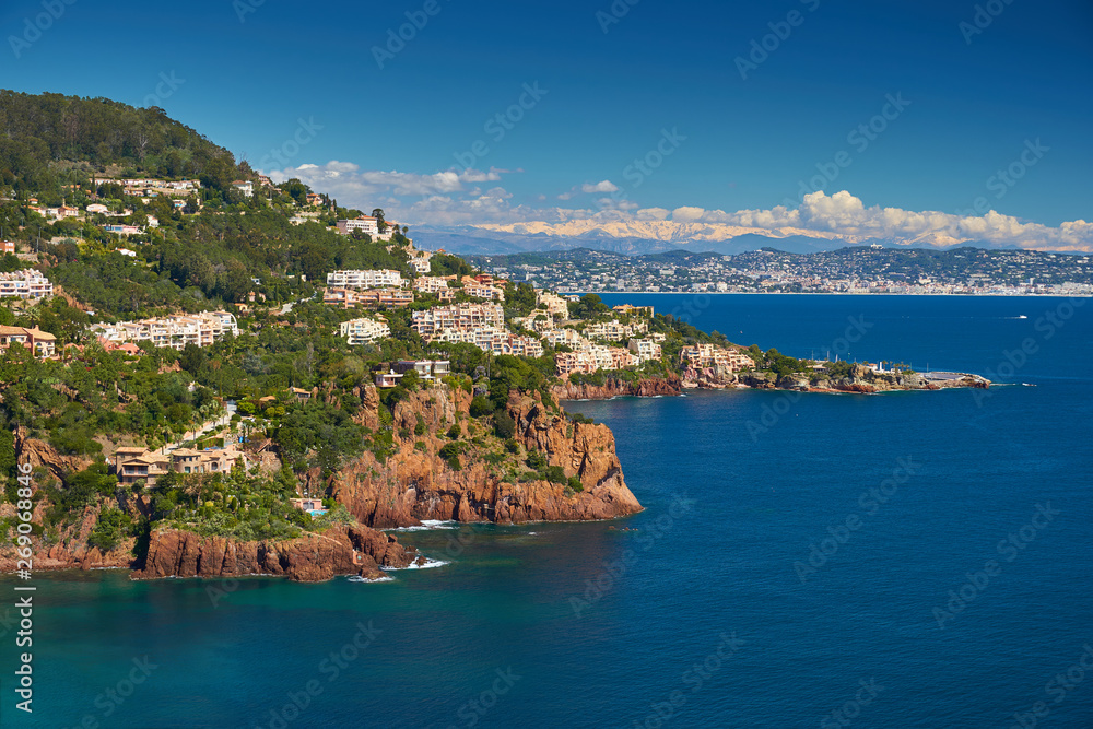 Beautiful view of French Riviera shore in April. Nice is on the background and Alps mountains
