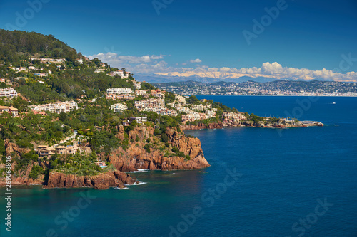 Fototapeta Naklejka Na Ścianę i Meble -  Beautiful view of French Riviera shore in April. Nice is on the background and Alps mountains