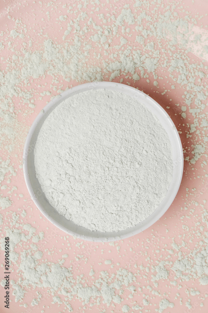 Top view of white cosmetic clay powder in a bowl Top view of white cosmetic clay powder in a bowl