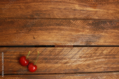 delicious cherries on wooden background