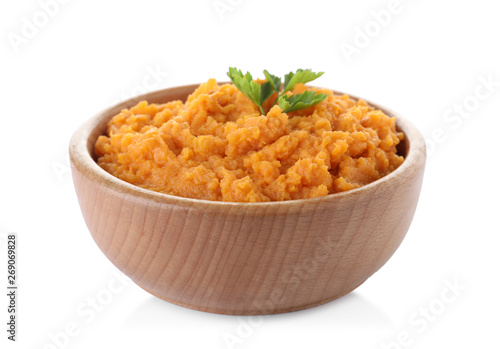Bowl with mashed sweet potatoes on white background