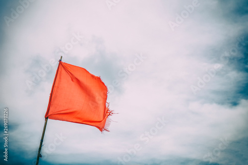 Red flag warning flags wind blue sky