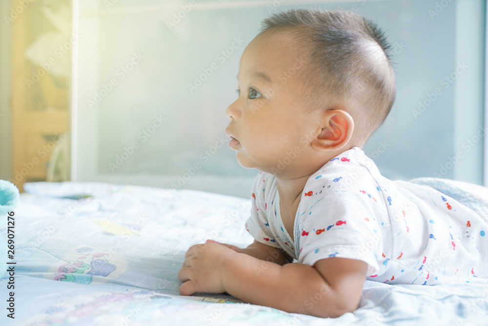 Funny baby boy crawling on blanket in bed room Funny baby boy crawling on blanket in bed room