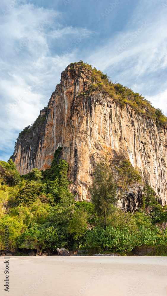 Big orange limestone cliff  with space for copy