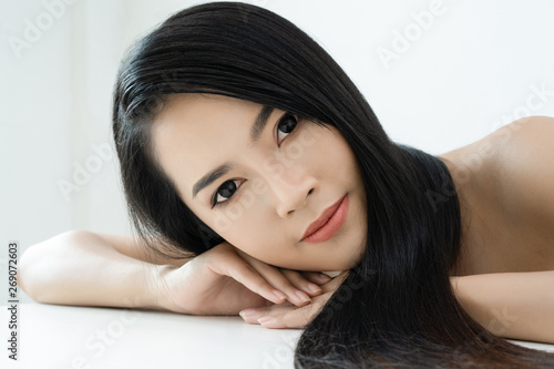 Beautiful Asian woman with healthy skin and beautiful hairstyle on white background. Woman of a healthy well-groomed long hair,Advertising of hair care. Healthy Long Hair Concept.