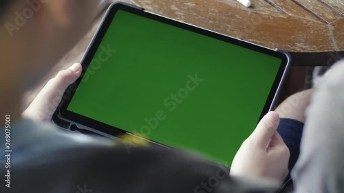 Mother and Son using digital tablet together, Green screen chroma key.